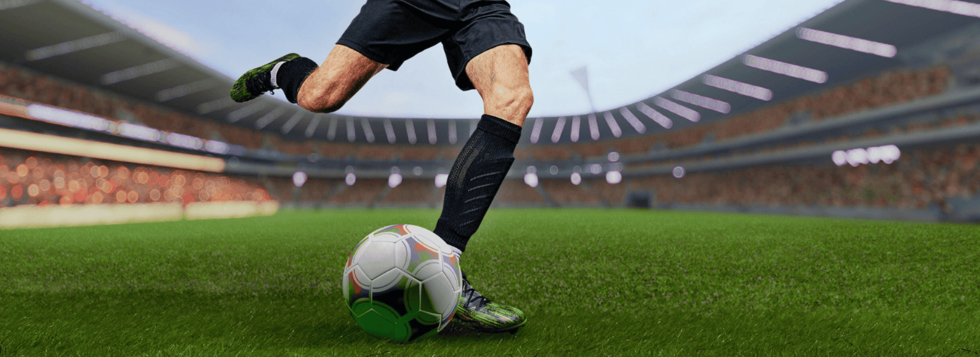 FIFA player kicking soccer ball in stadium